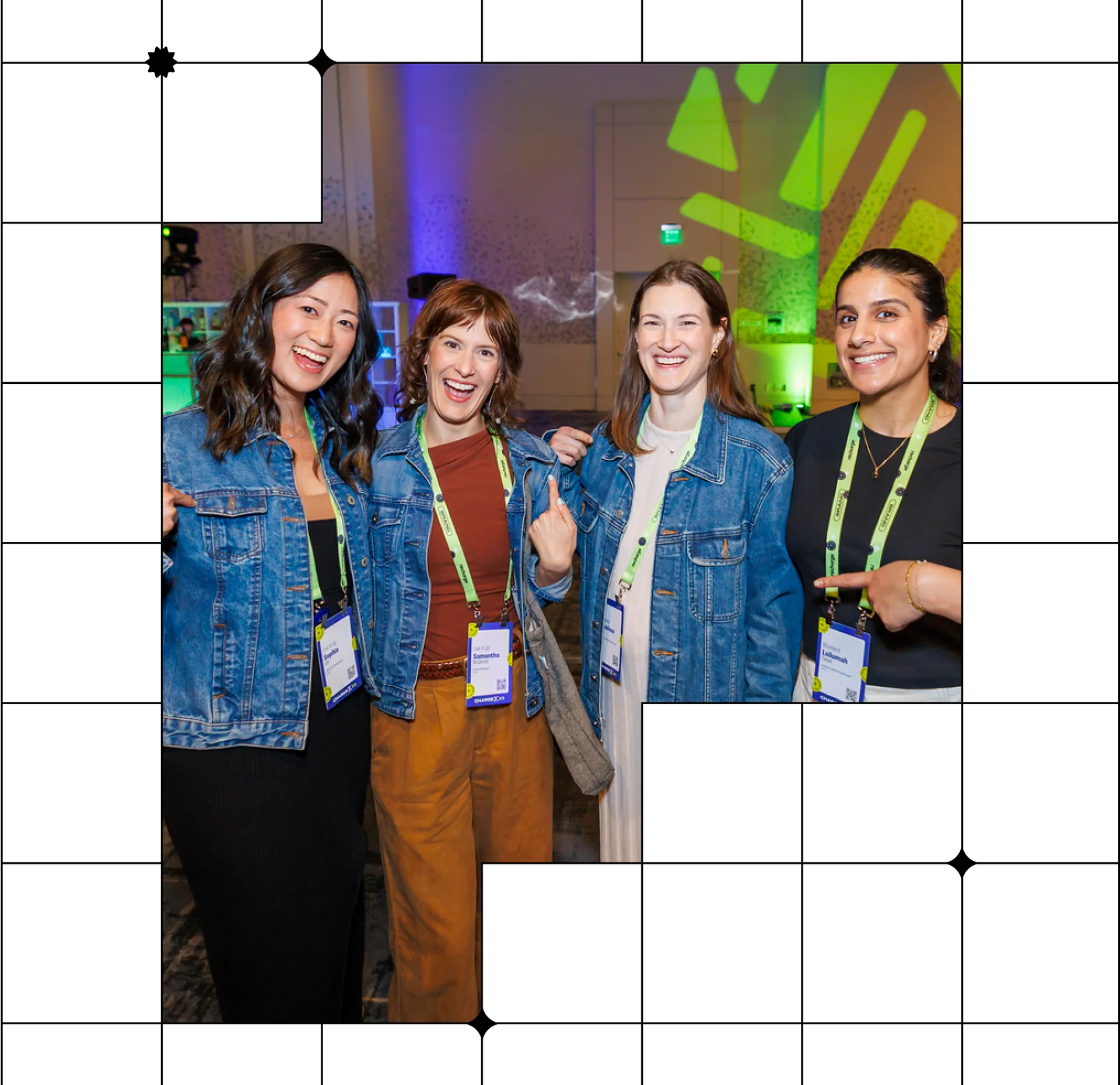 A group of four women smiling at an event while wearing denim jackets.