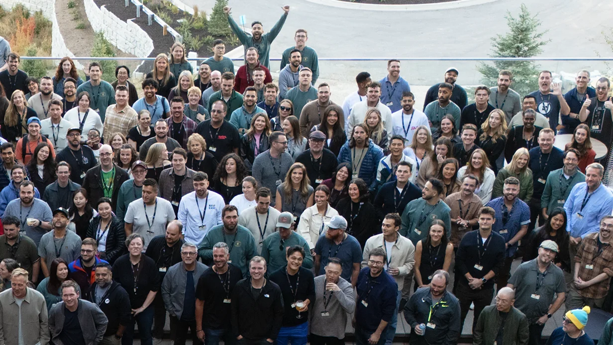 A diverse group of people gathered in a team photo during an event.