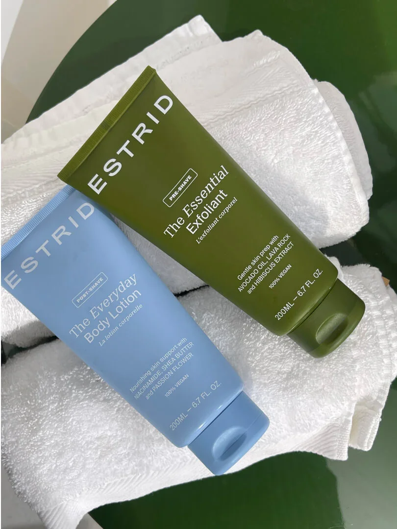 Two Estrid skincare products placed on towels.