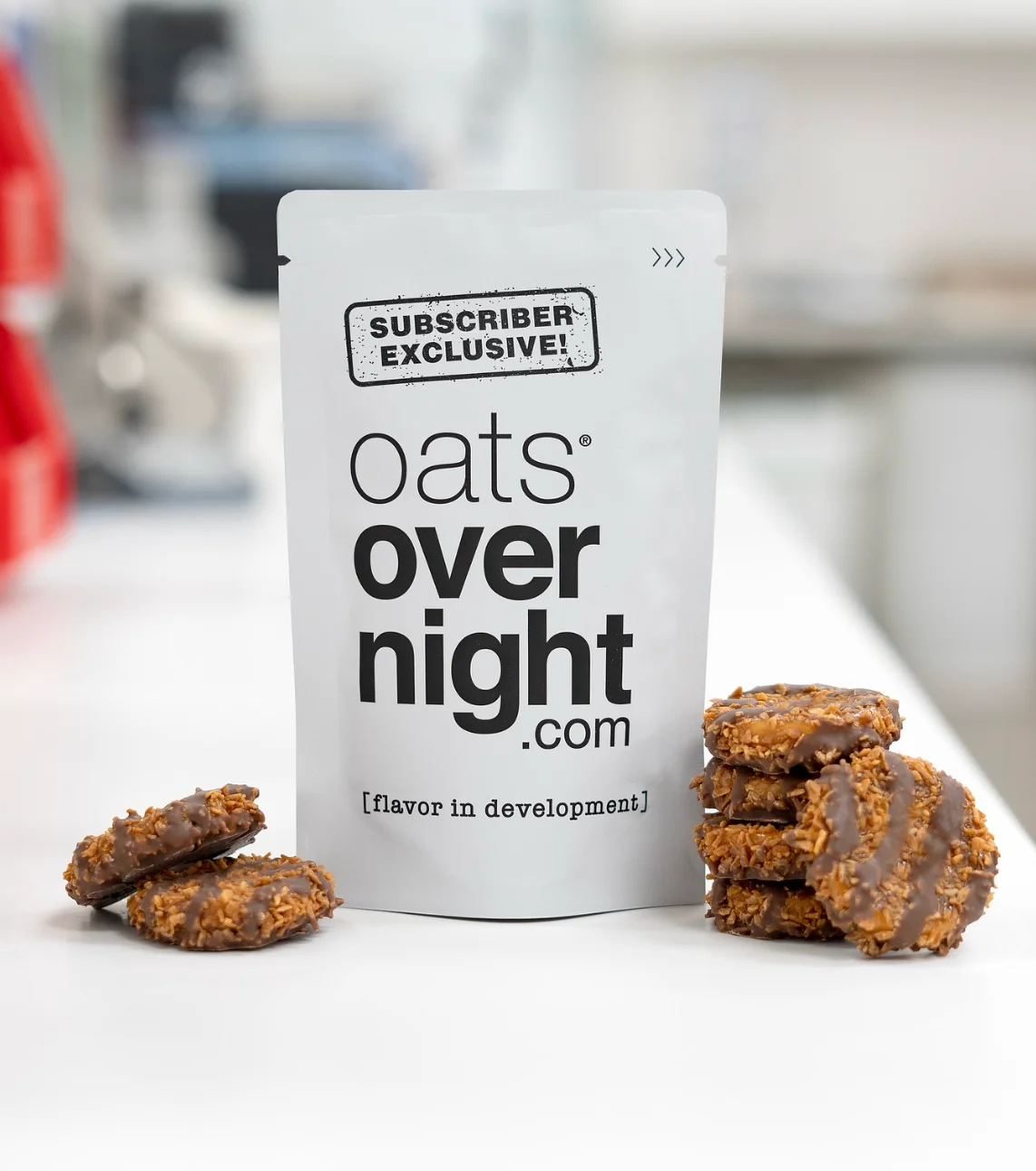 A packet of oats overnight product with cookies placed beside it.