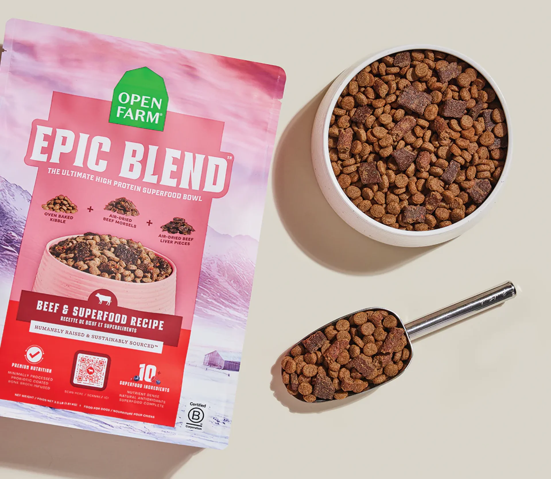 A bag of Open Farm Epic Blend dog food with a bowl of kibble.