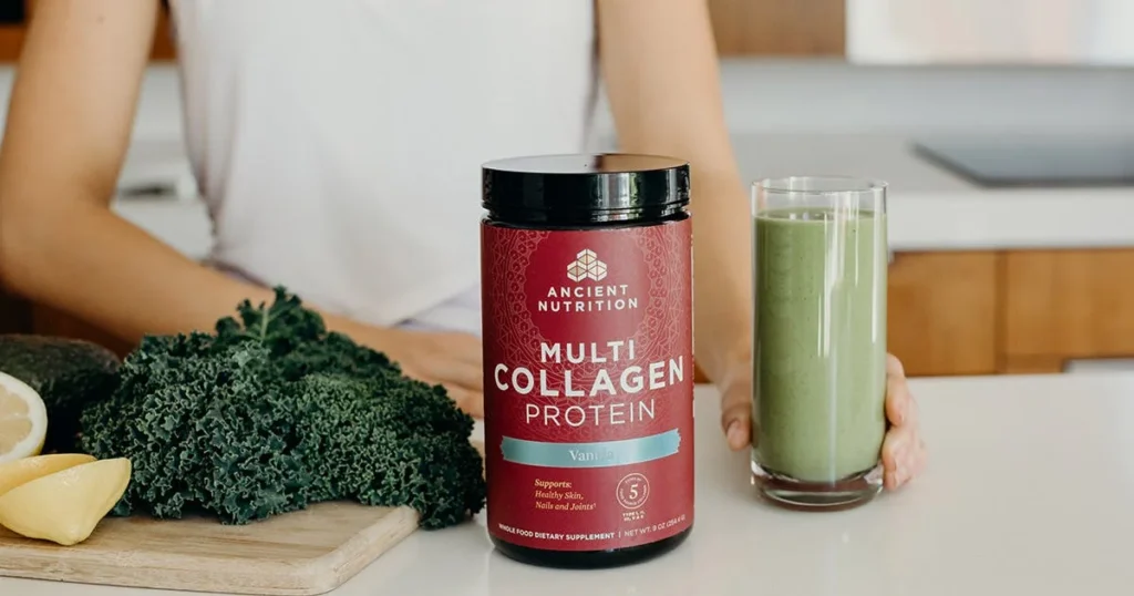 A container of Ancient Nutrition Multi Collagen Protein displayed with fresh ingredients and a green smoothie.