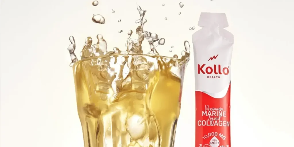 A glass of liquid splashing next to a Kollo Health collagen product pack.