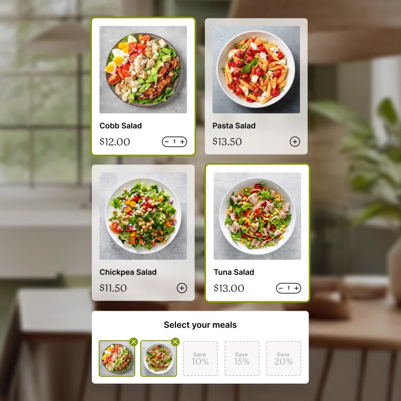 Four different salad options with prices displayed on a digital interface.