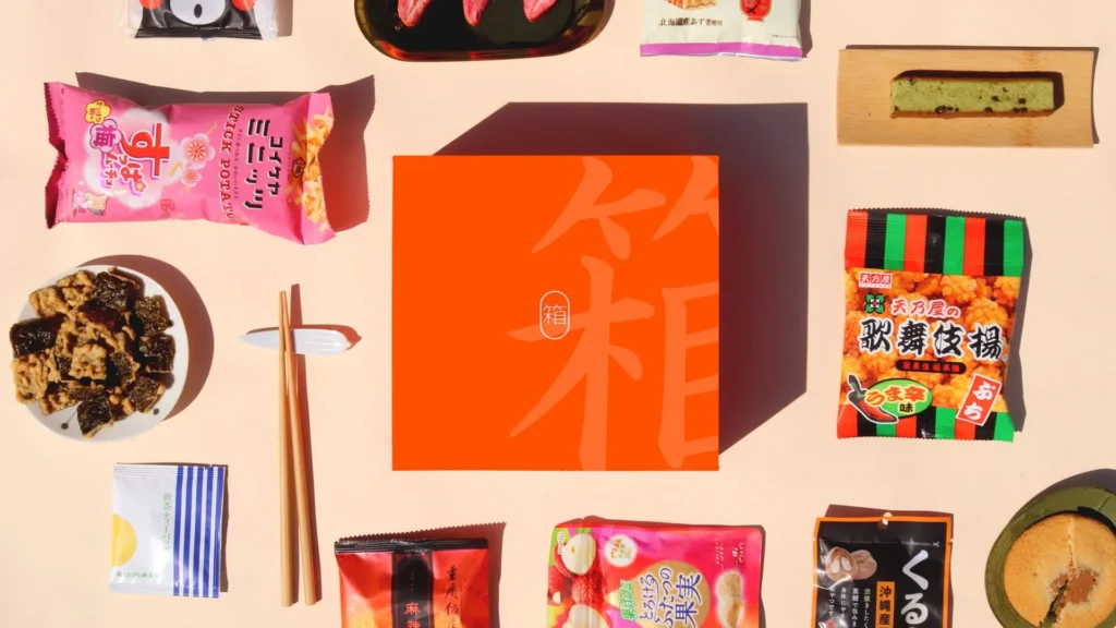 An assortment of Japanese snacks including chips and sweets on a table.