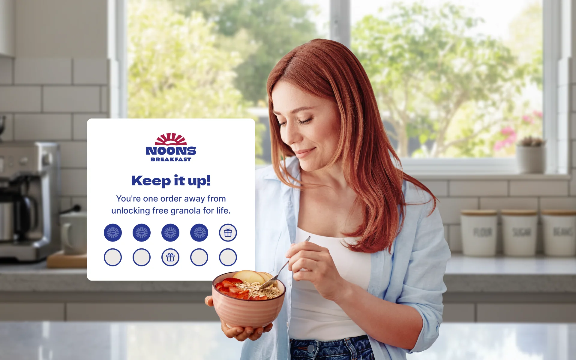 A person enjoying breakfast while reading a message about their order status.