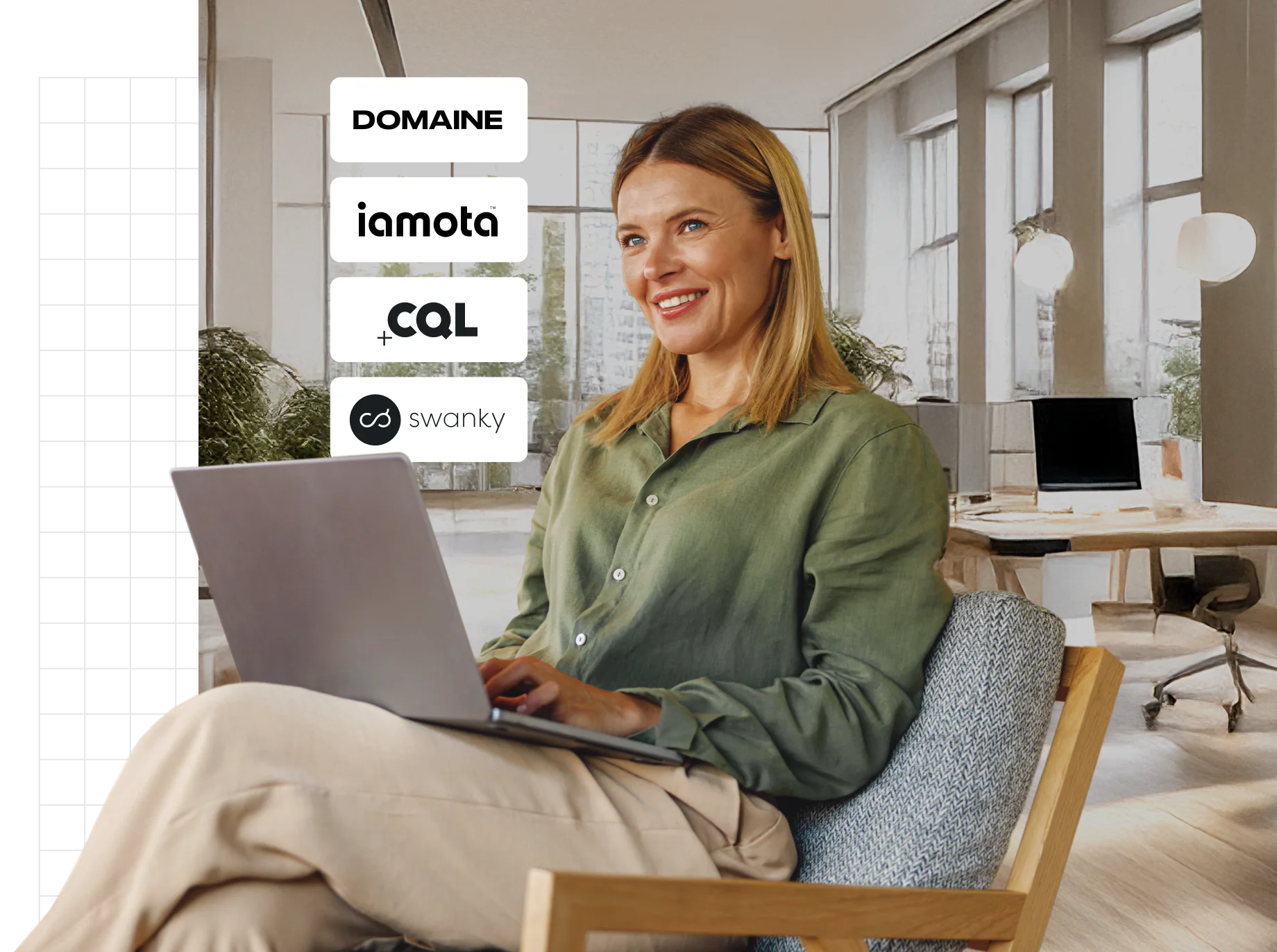 A person sitting in a chair using a laptop in a modern workspace.