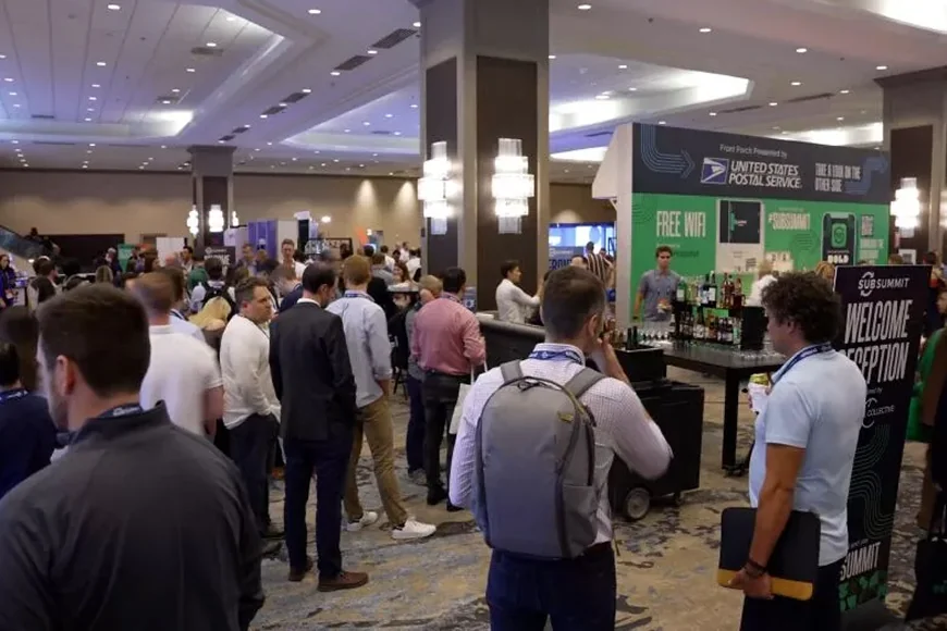 Attendees networking at the Sub Summit event in a venue.