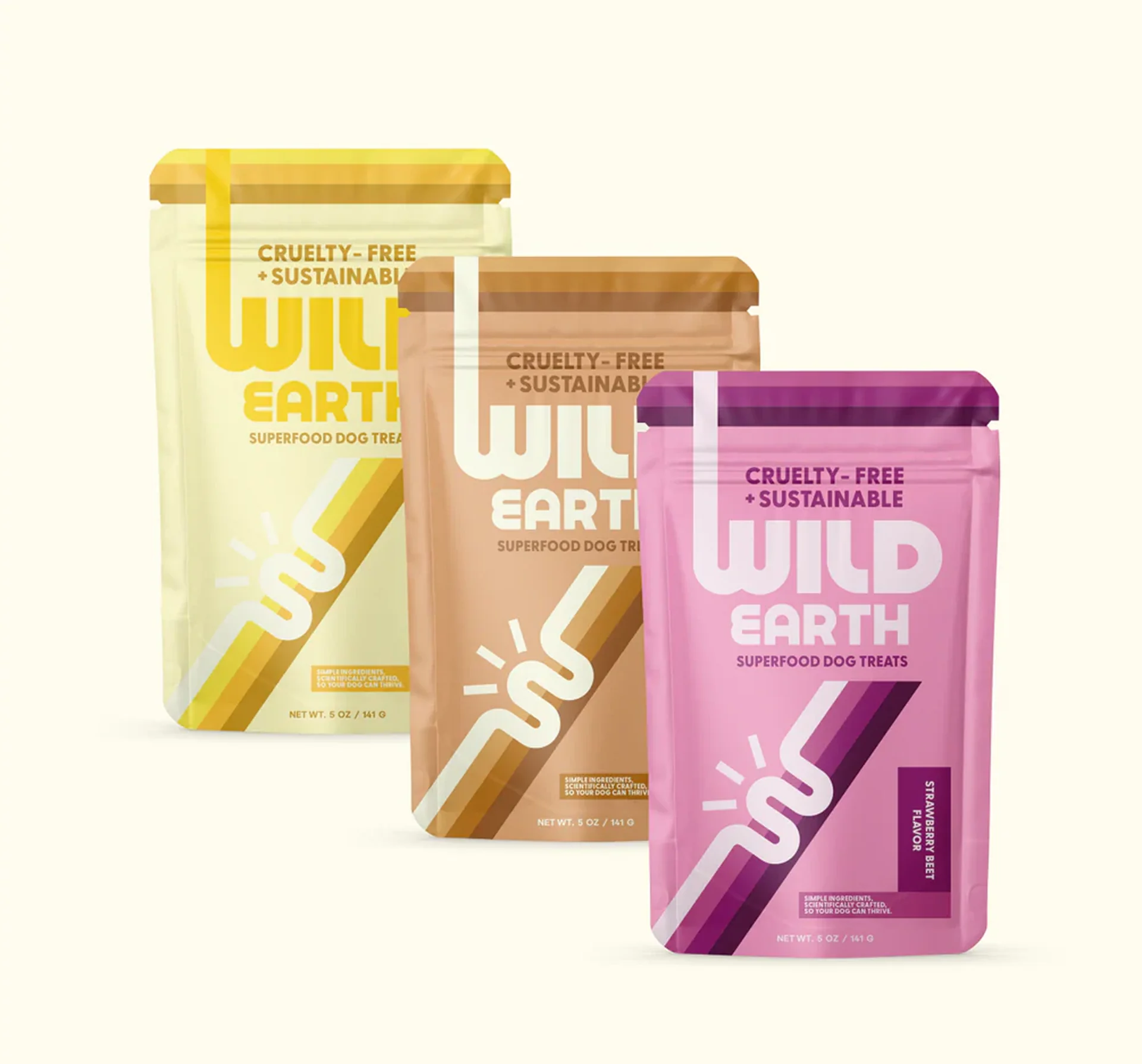 Three packages of Wild Earth superfood dog treats.