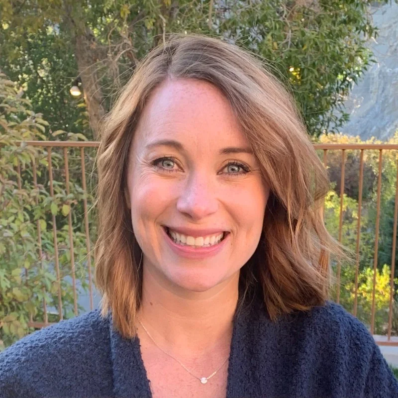 Avatar image of Callie Hawley smiling outdoors with greenery in the background.