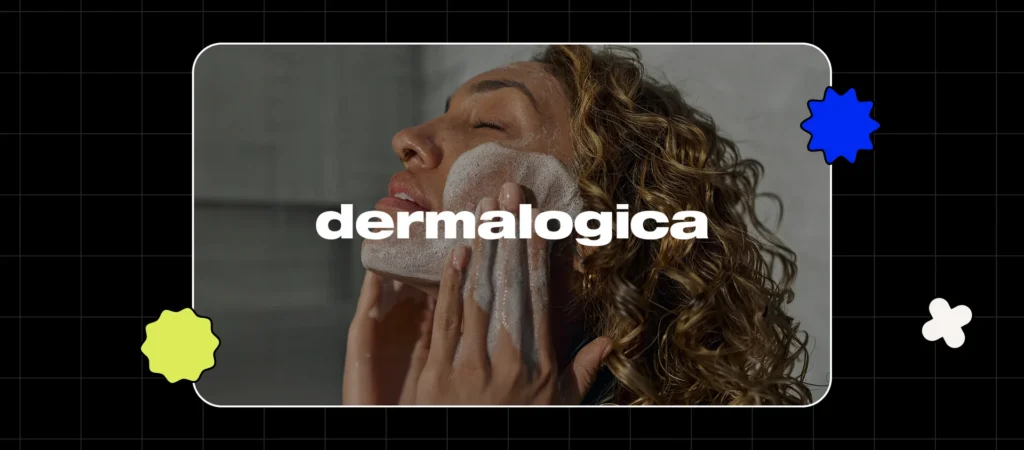 A person applying a foamy cleanser to their face during a skincare routine.