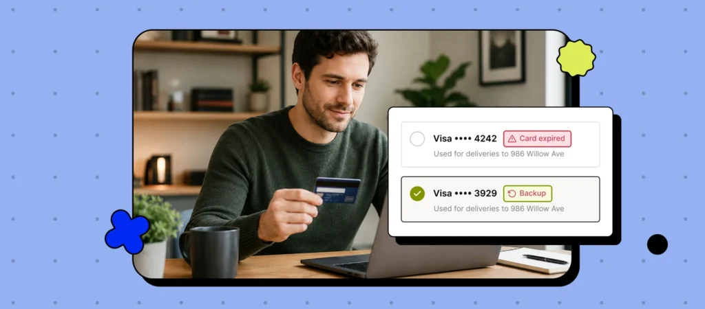 A person holds a credit card while using a laptop.